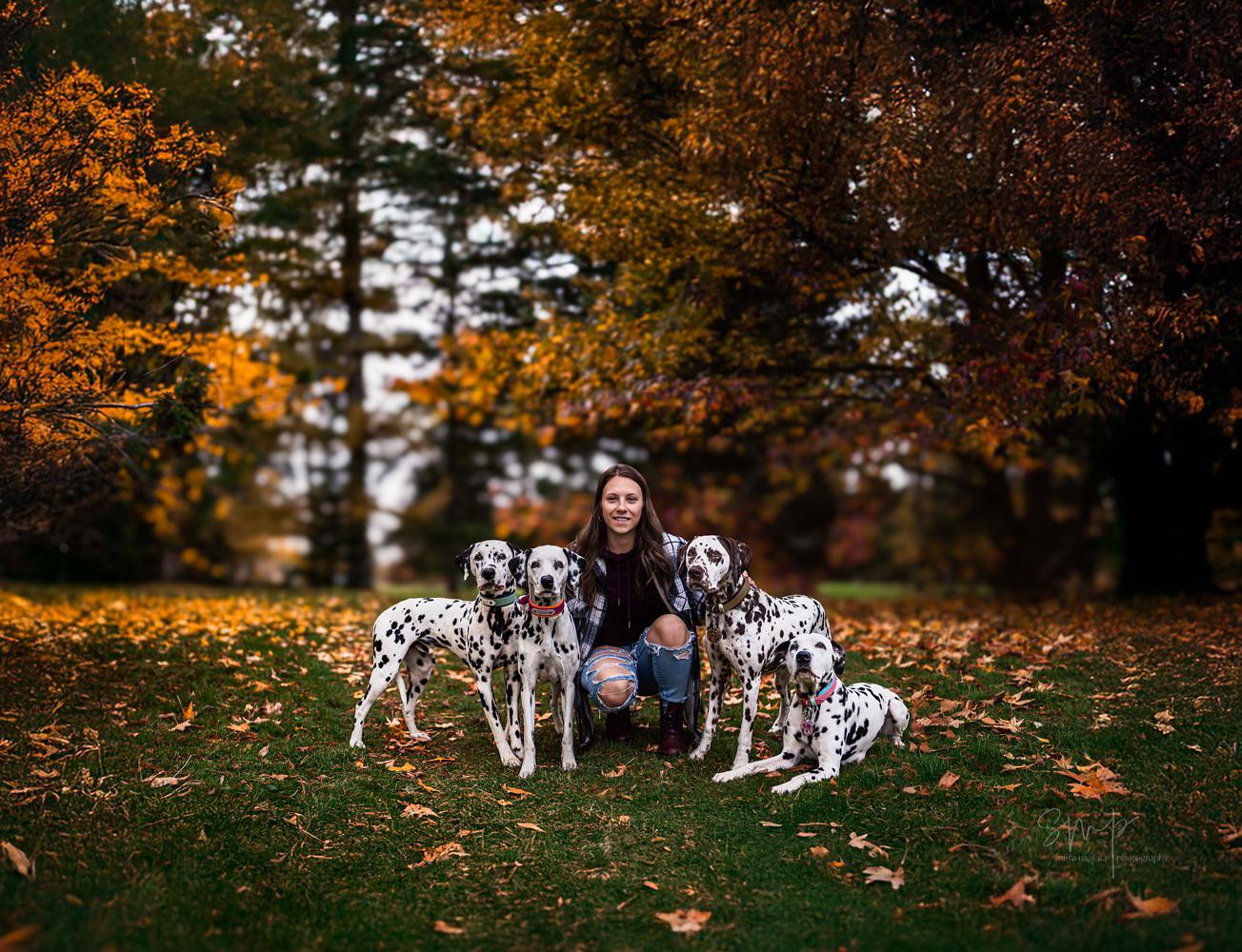 Bridgitte training a group of Dalmatians outdoors